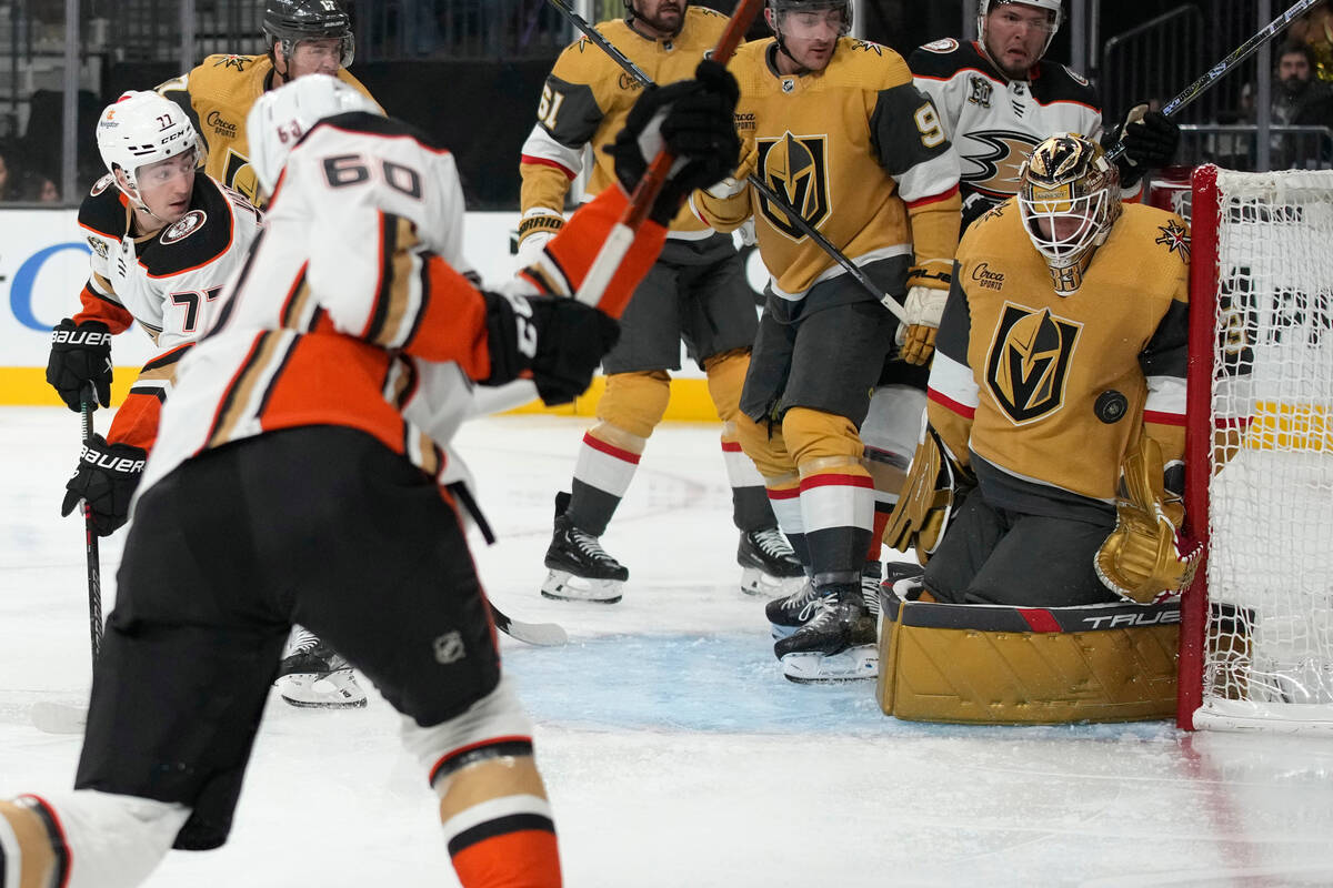 Vegas Golden Knights goaltender Adin Hill (33) blocks a shot by Anaheim Ducks defenseman Jackso ...