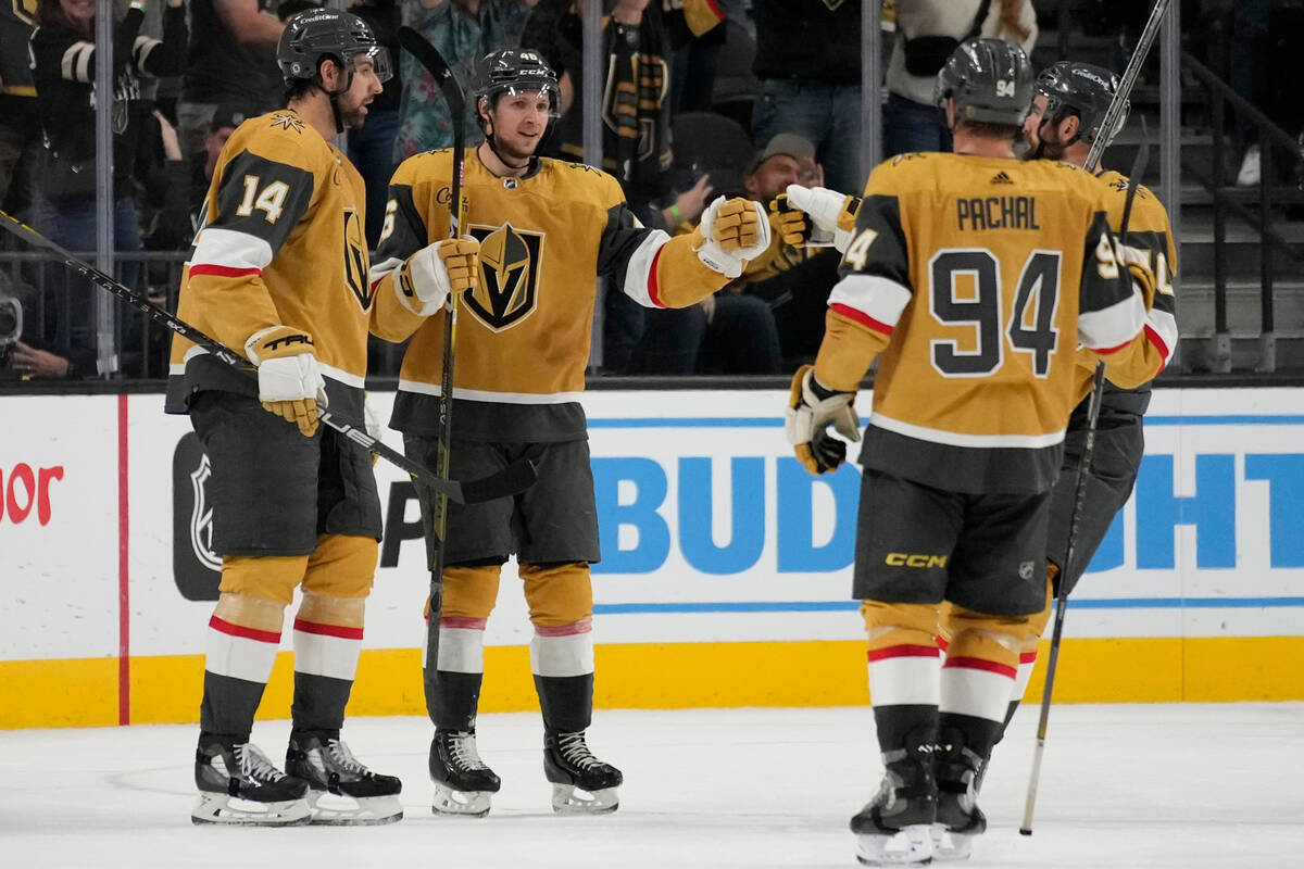 Vegas Golden Knights' Jonas Rondbjerg, second from left, celebrates after scoring on an open go ...