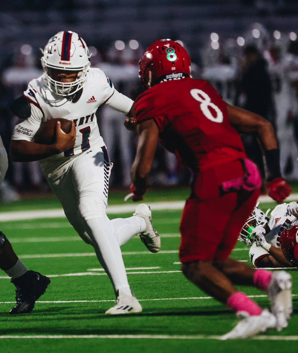 Liberty quarterback Tyrese Smith (11) runs the ball down the field during a game against Arbor ...