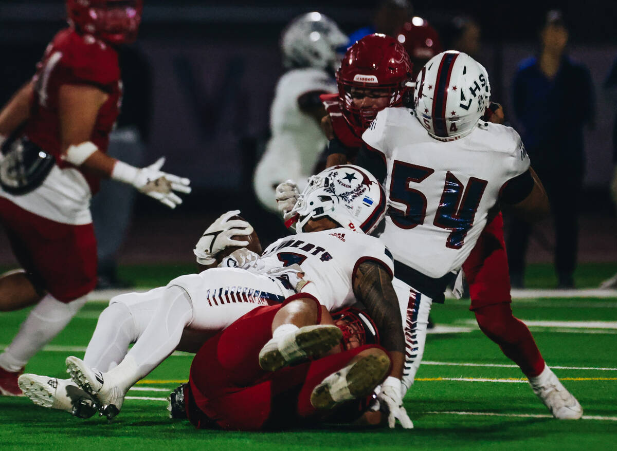 Liberty wide receiver Jayden Robertson (7) is taken down with the ball during a game against Ar ...