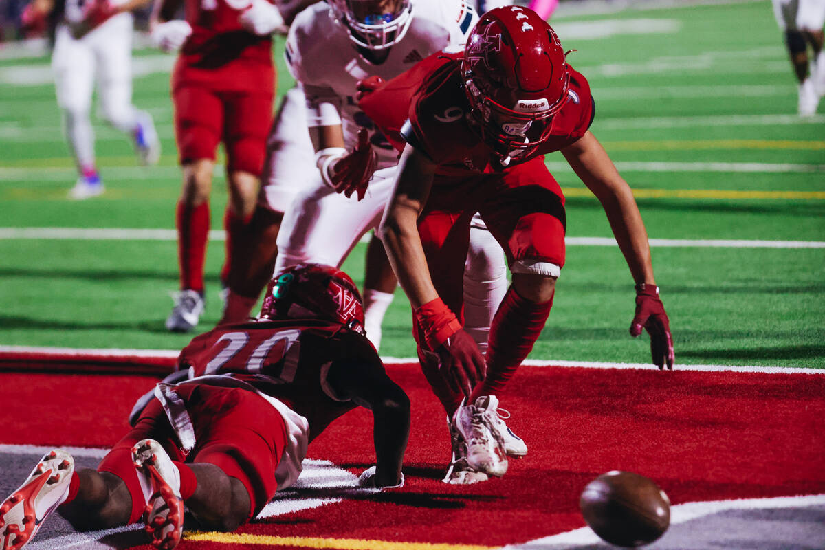 Arbor View wide receiver Kai Cypher (9) picks up the ball in the end zone during a game against ...