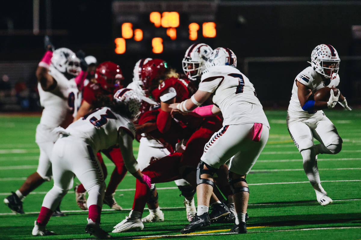 Liberty running back Isaiah Lauofo (3) steaks the ball down the field during a game against Arb ...