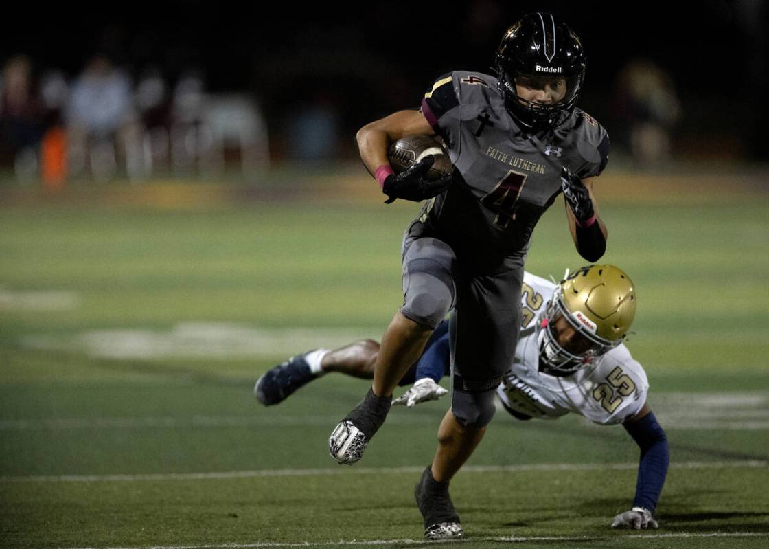 Faith Lutheran running back Sean Sampson (4) runs toward the end zone while Foothill strong sa ...