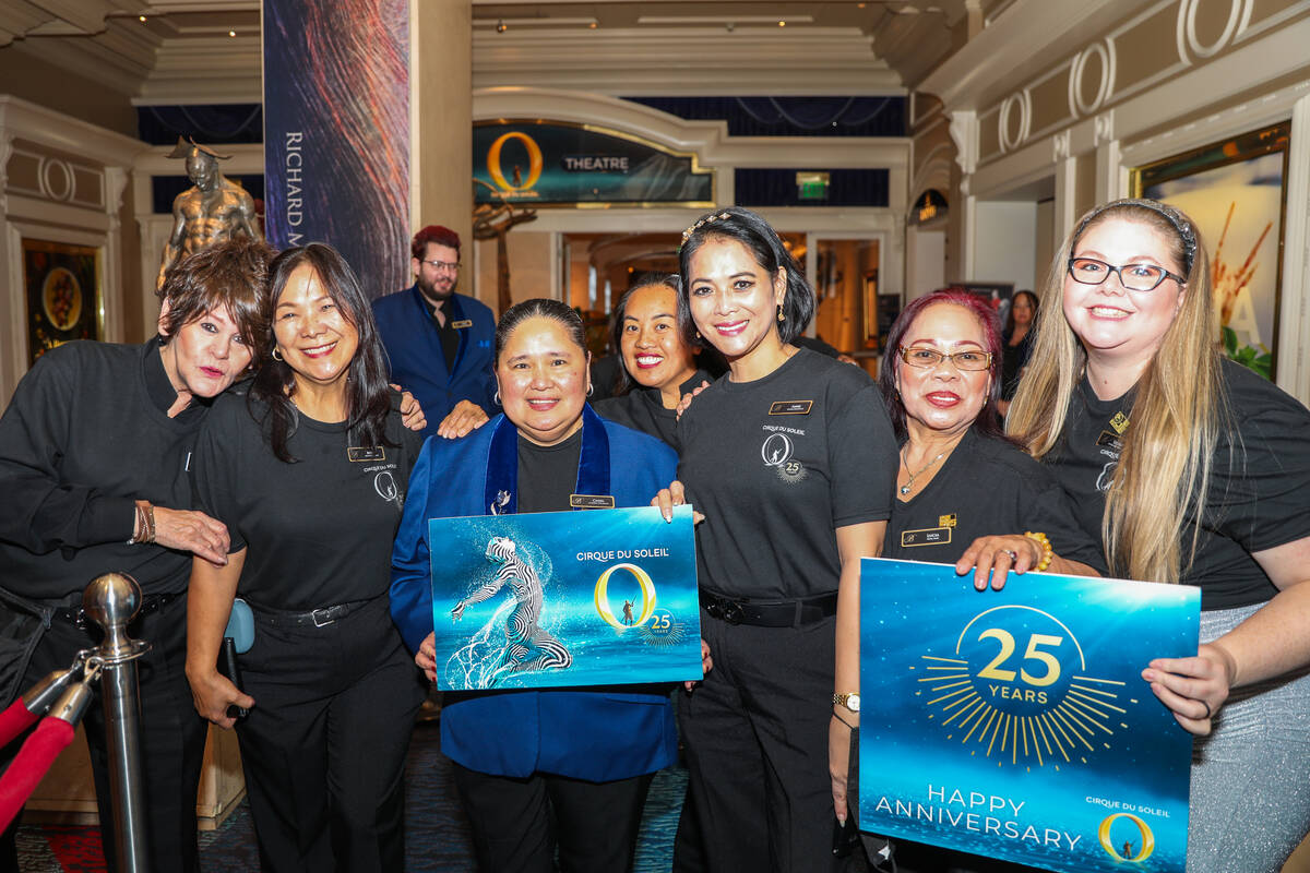 Theater ushers for Cirque du Soleil shows pose prior to the “O” anniversary parad ...