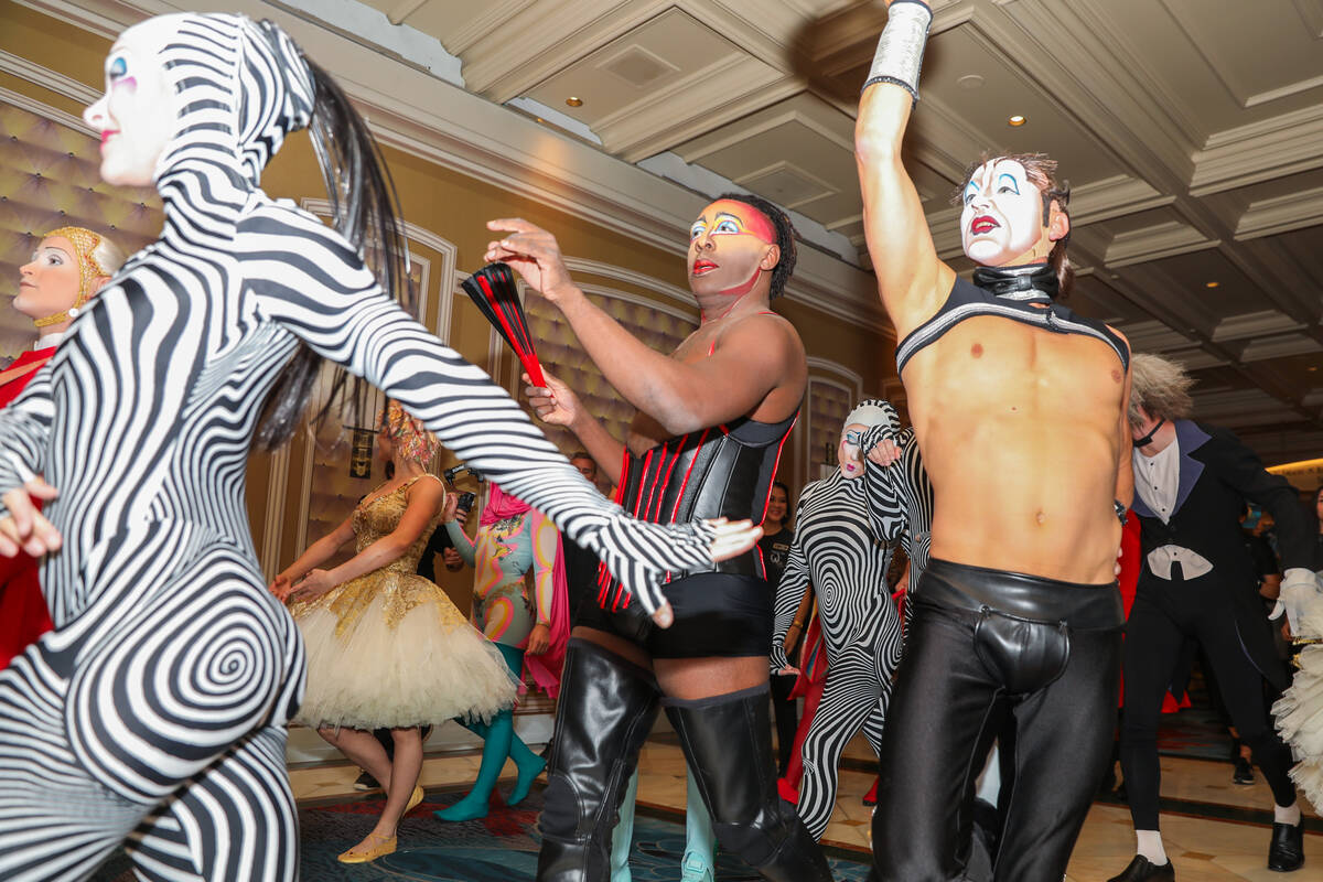 Cirque du Soleil performers walk through the Bellagio as part of the “O” annivers ...