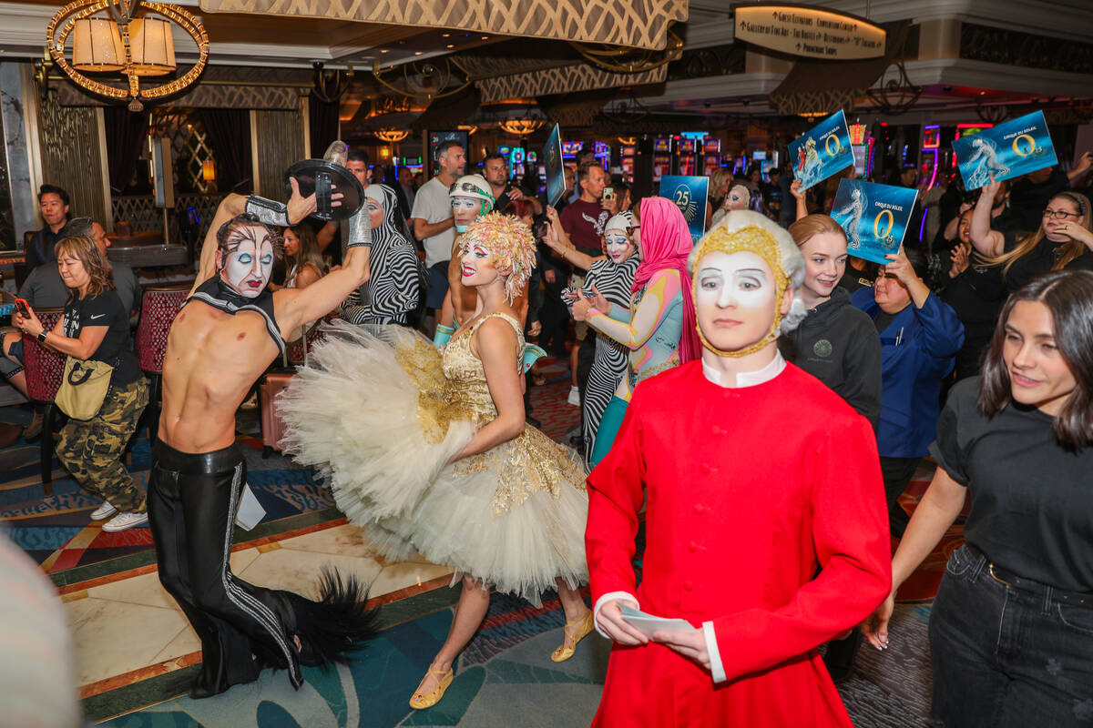 Cirque du Soleil performers walk through the Bellagio as part of the “O” annivers ...