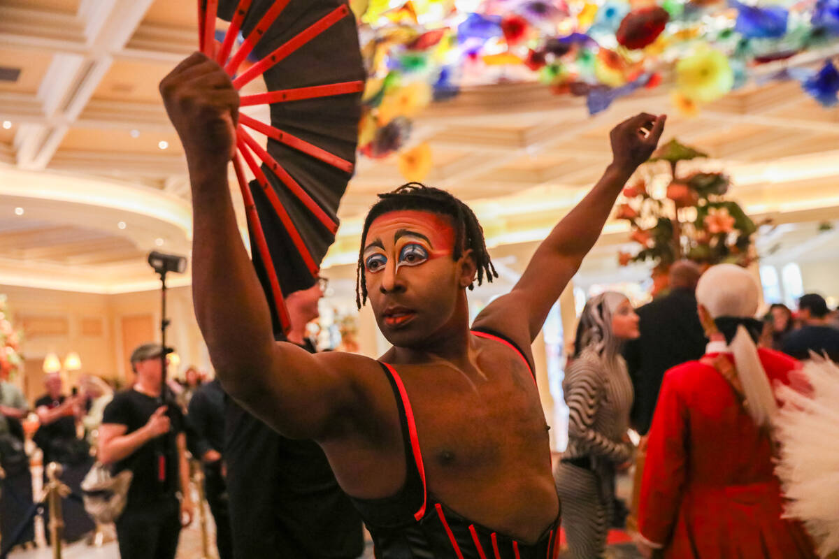 Cirque du Soleil performers walk through the Bellagio as part of the “O” annivers ...