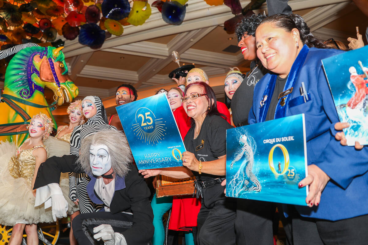 Cirque du Soleil performers and ushers walk through the Bellagio as part of the “O&#x201 ...