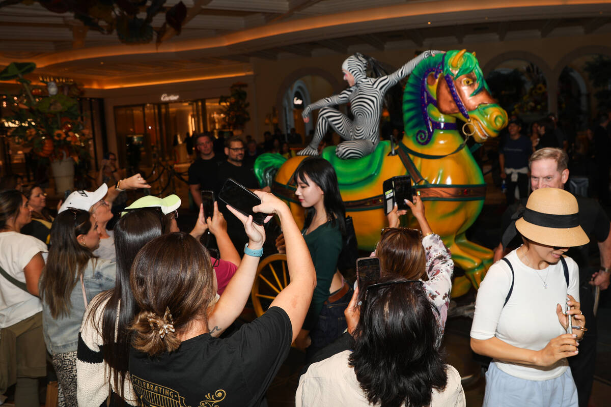 Bellagio guests watch as Cirque du Soleil performers and ushers walk in the “O” a ...