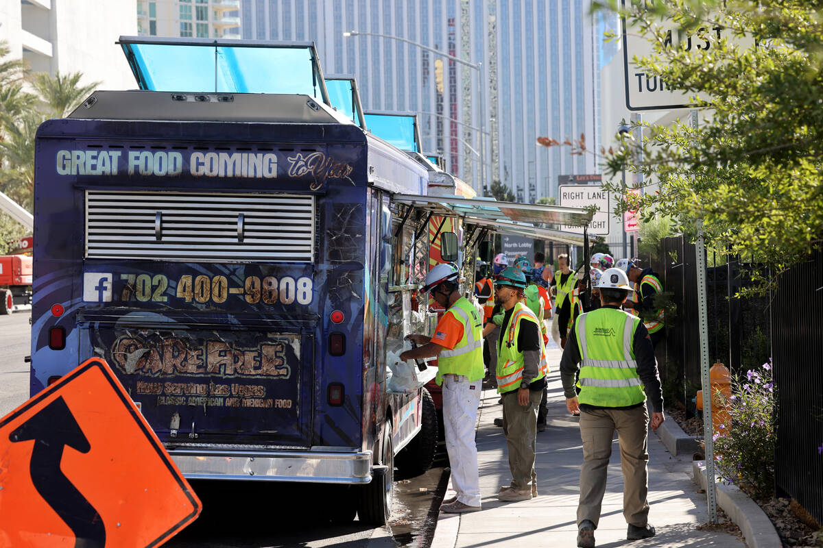 Food trucks serve customers on Elvis Presley Boulevard near the Strip in Las Vegas on Friday, O ...