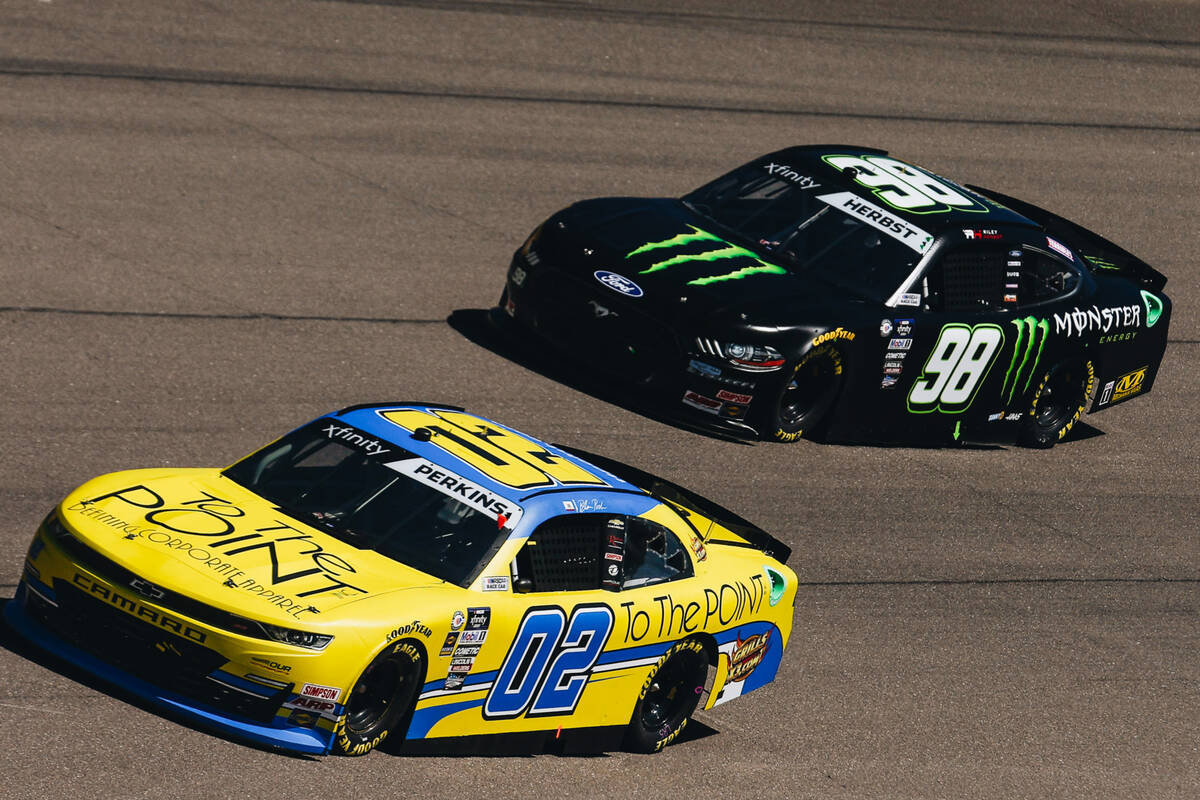 Riley Herbst (98) and Blaine Perkins (02) race the track during the NASCAR Xfinity Series race ...