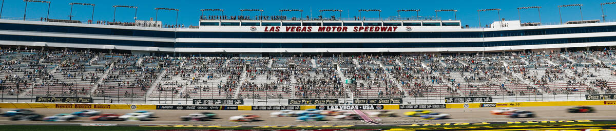 Race cars race along the track during the NASCAR Xfinity Series race at the Las Vegas Motor Spe ...