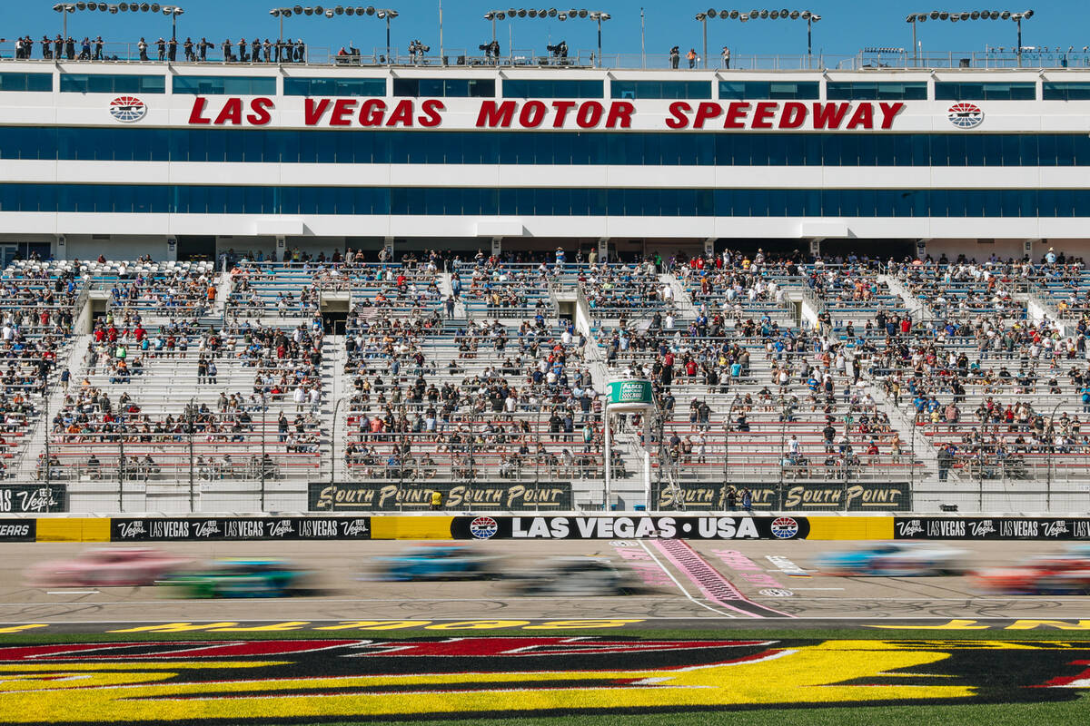 Race cars race along the track during the NASCAR Xfinity Series race at the Las Vegas Motor Spe ...