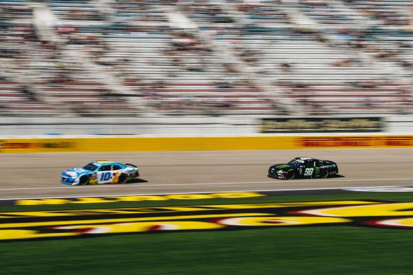 Austin Dillon (10) and Riley Herbst (98) race their cars along the track during the NASCAR Xfin ...