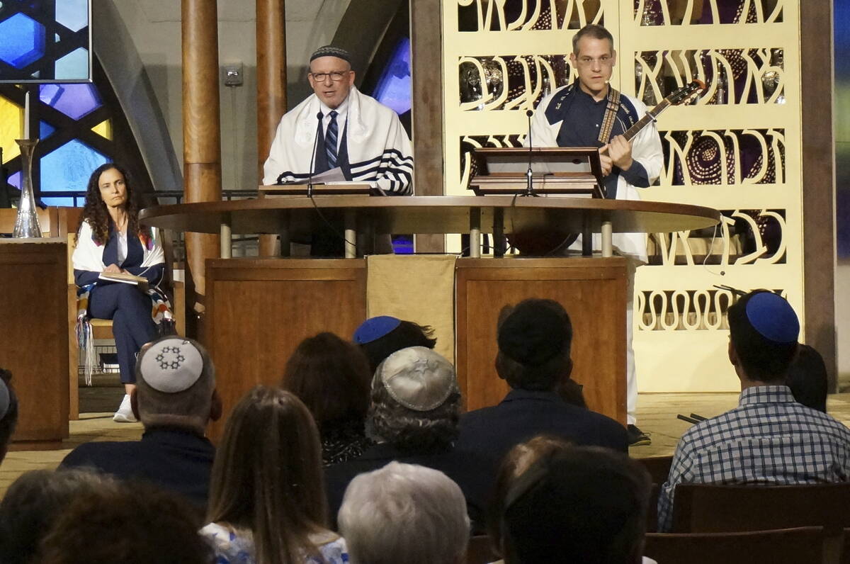 Senior Rabbi Gayle Pomerantz, seated, left, Rabbi Robert Davis and Cantor Juval Porat lead Shab ...