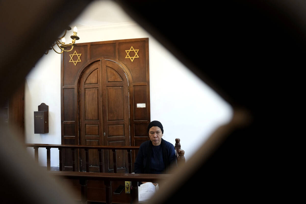 A woman prays at Shaar Hashamayim Synagogue in Tondano, North Sulawesi, Indonesia, on Saturday, ...