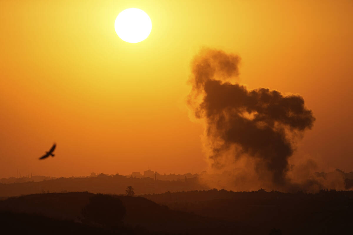 Smoke rises following an Israeli airstrike in the Gaza Strip, as seen from southern Israel, on ...