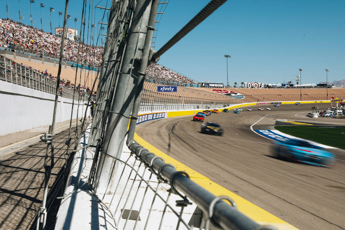 Race cars speed throughout the track during the South Point 400 at the Las Vegas Motor Speedway ...