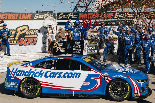 Kyle Larson celebrates on top of his car after winning the South Point 400 at the Las Vegas Mot ...