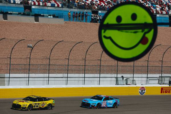 A signal stick sticks out as racers drive throughout the track during the South Point 400 at th ...
