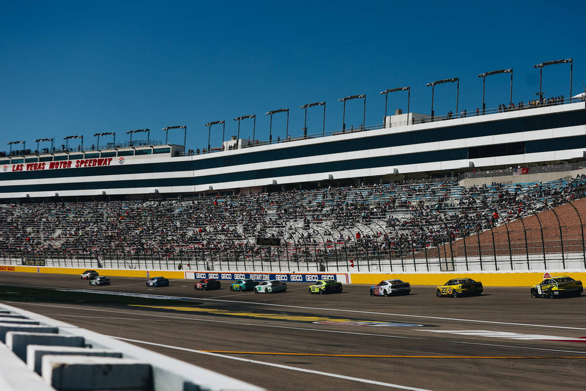 Race cars speed throughout the track during the South Point 400 at the Las Vegas Motor Speedway ...