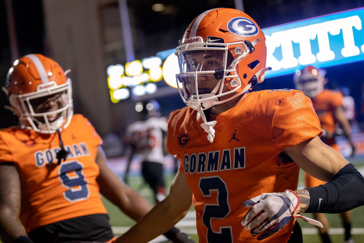 Bishop Gorman wide receiver Audric Harris (2) is congratulated on his touchdown by teammates du ...