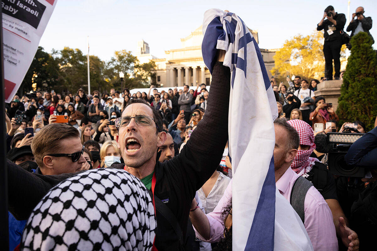 FILE - A pro-Israel demonstrator shouts at Palestinian supporters during a protest at Columbia ...