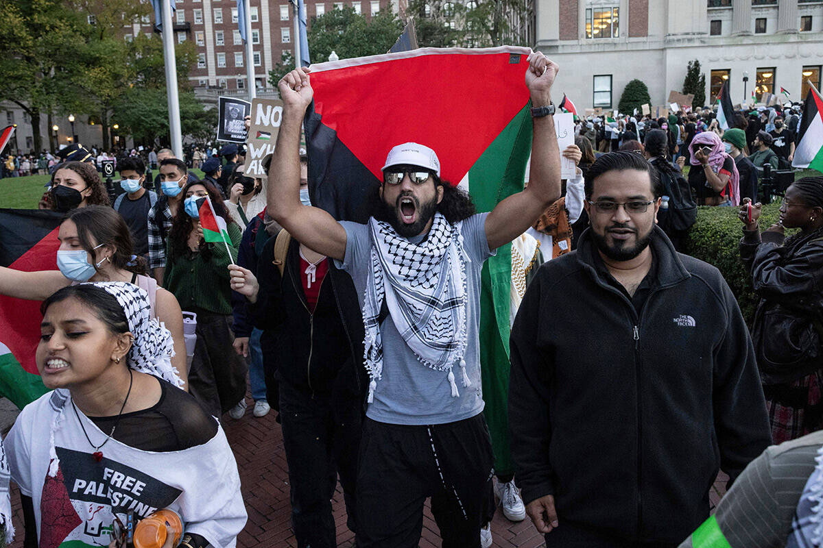 FILE - Palestinian supporters chant as they march during a protest at Columbia University, Thur ...