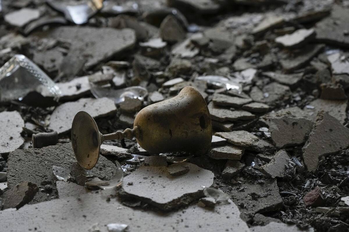 A burnt Kiddush Cup in a house damaged by Hamas militants is seen in Kibbutz Be'eri, Israel, Sa ...