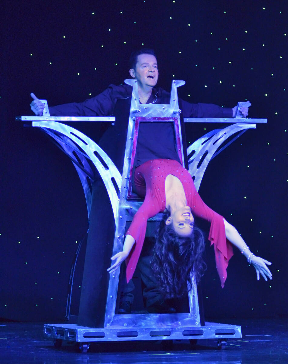 Magician Dirk Arthur, top, performs with dancer Destiny Johnson in “Dirk Arthur’s Wild Illu ...