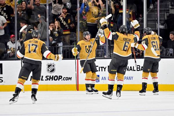 The Vegas Golden Knights celebrate center William Karlsson's (71) goal during the third period ...