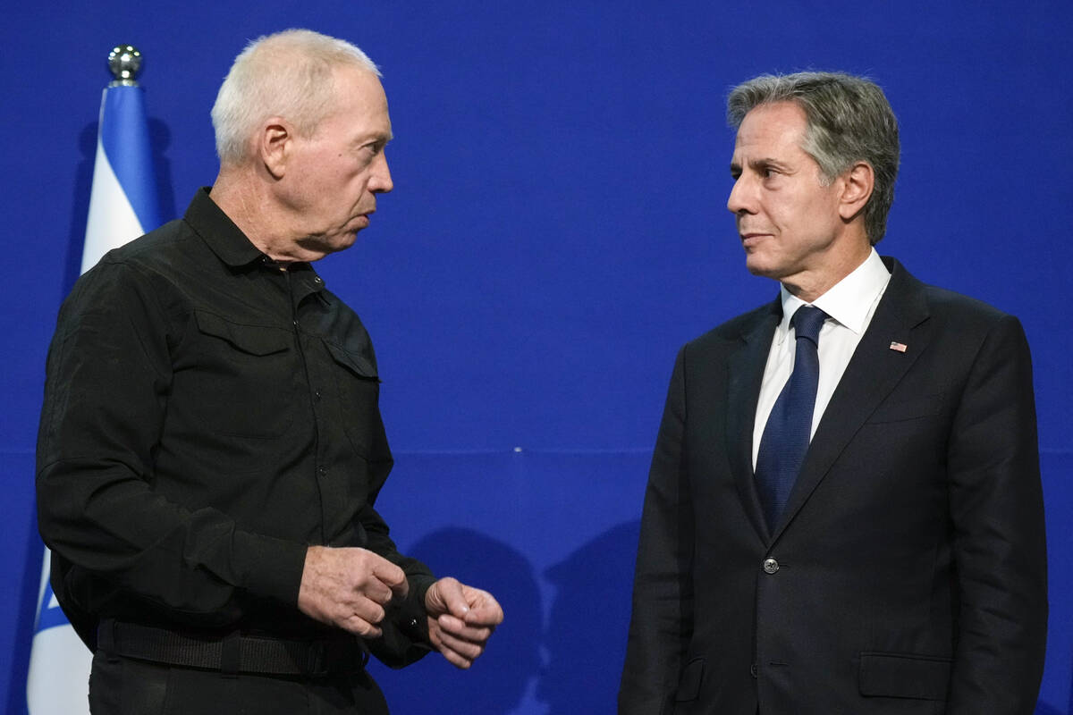 U.S. Secretary of State Antony Blinken, right, listens as Israeli Defense Minister Yoav Gallant ...