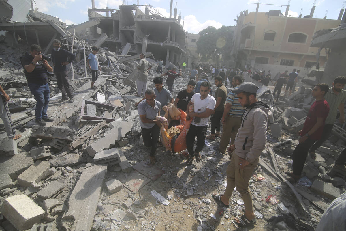 Palestinians evacuate wounded in Israeli bombardment of Rafah, southern Gaza Strip, Tuesday, Oc ...