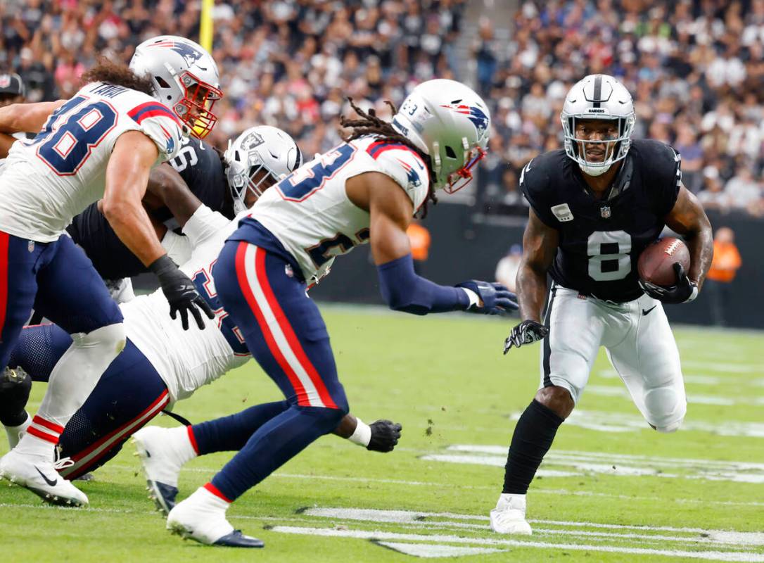 Raiders running back Josh Jacobs (8) runs with the ball during the first half of an NFL footbal ...