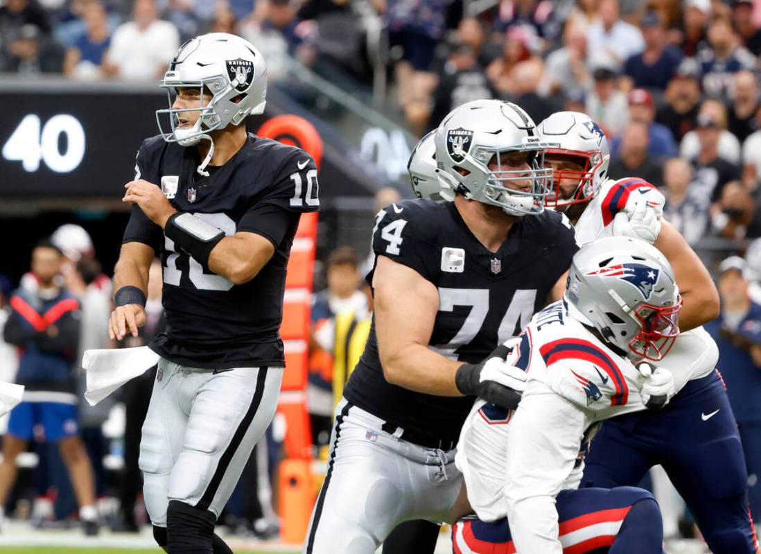 Raiders quarterback Jimmy Garoppolo (10) watches his throw during the first half of an NFL foot ...