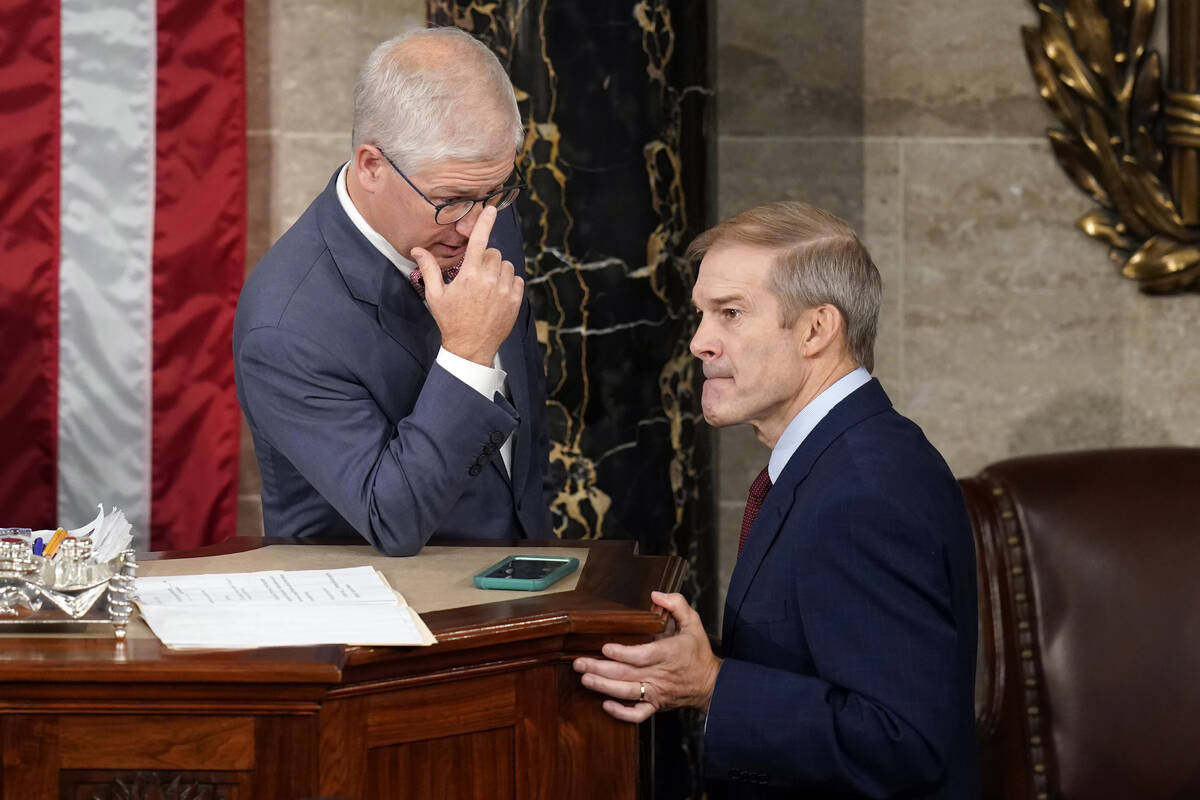 Temporary House leader Rep. Patrick McHenry, R-N.C., talks with Rep. Jim Jordan, R-Ohio, as Rep ...