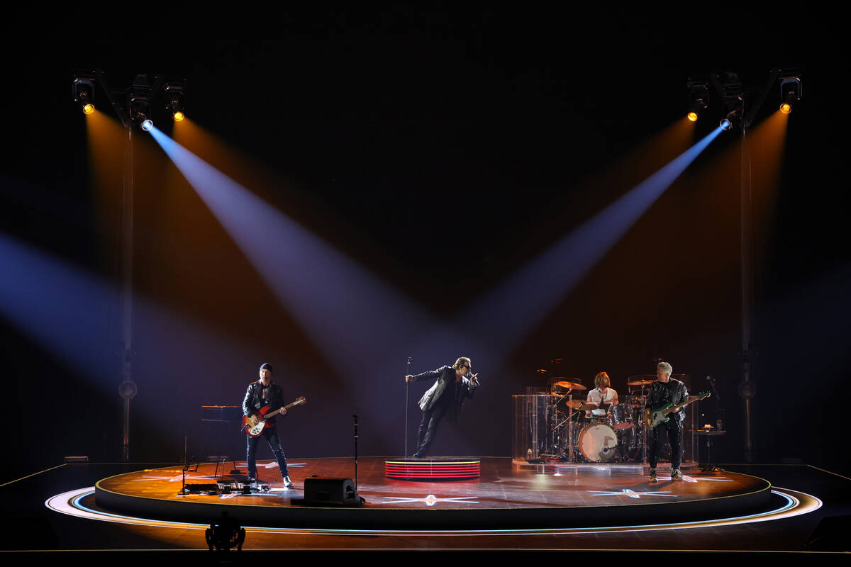 Bono, The Edge, Adam Clayton and Bram van den Berg of U2 perform during opening night of "U2:UV ...