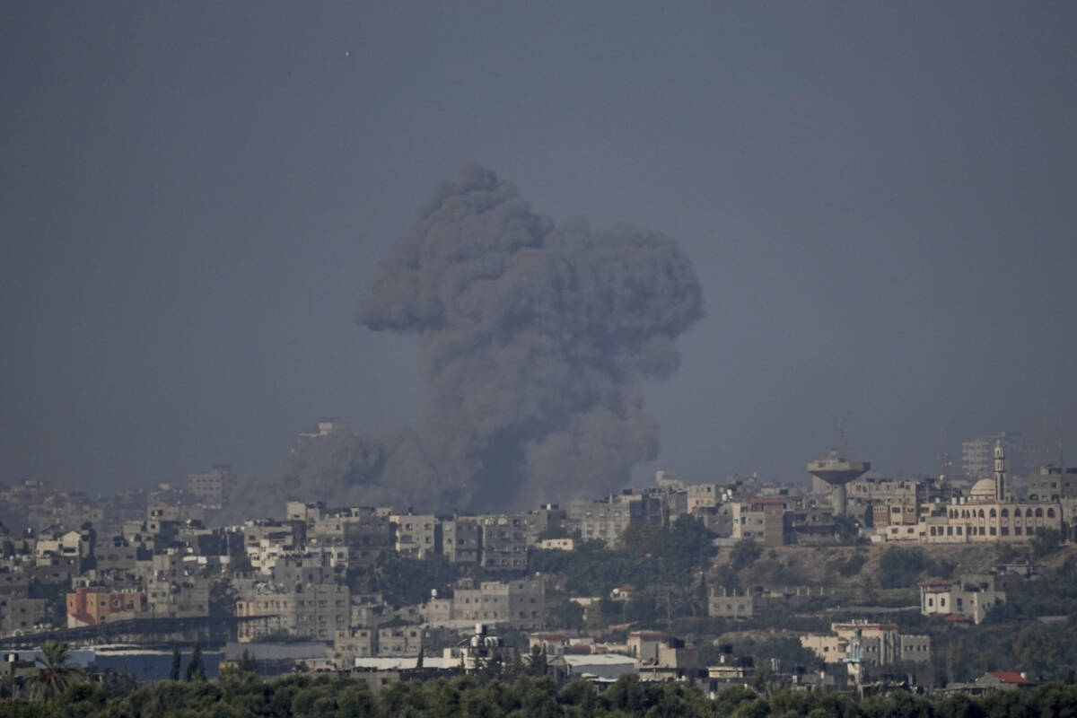 Smoke rises following an Israeli airstrike in the Gaza Strip, as seen from southern Israel, Thu ...