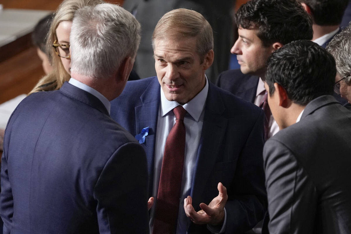 Rep. Jim Jordan, R-Ohio, talks with Rep. Kevin McCarthy, R-Calif., and others as Republicans tr ...