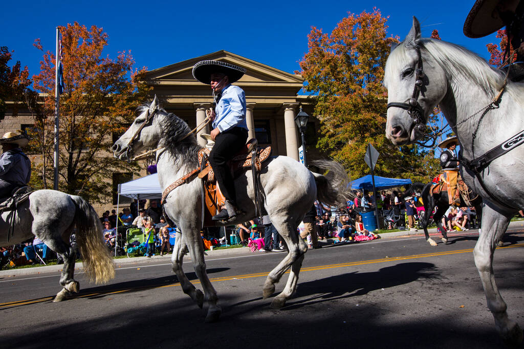 Members of Escaramuza Charra Perlas de Nevada lead their horses in a dance during the annual Ne ...