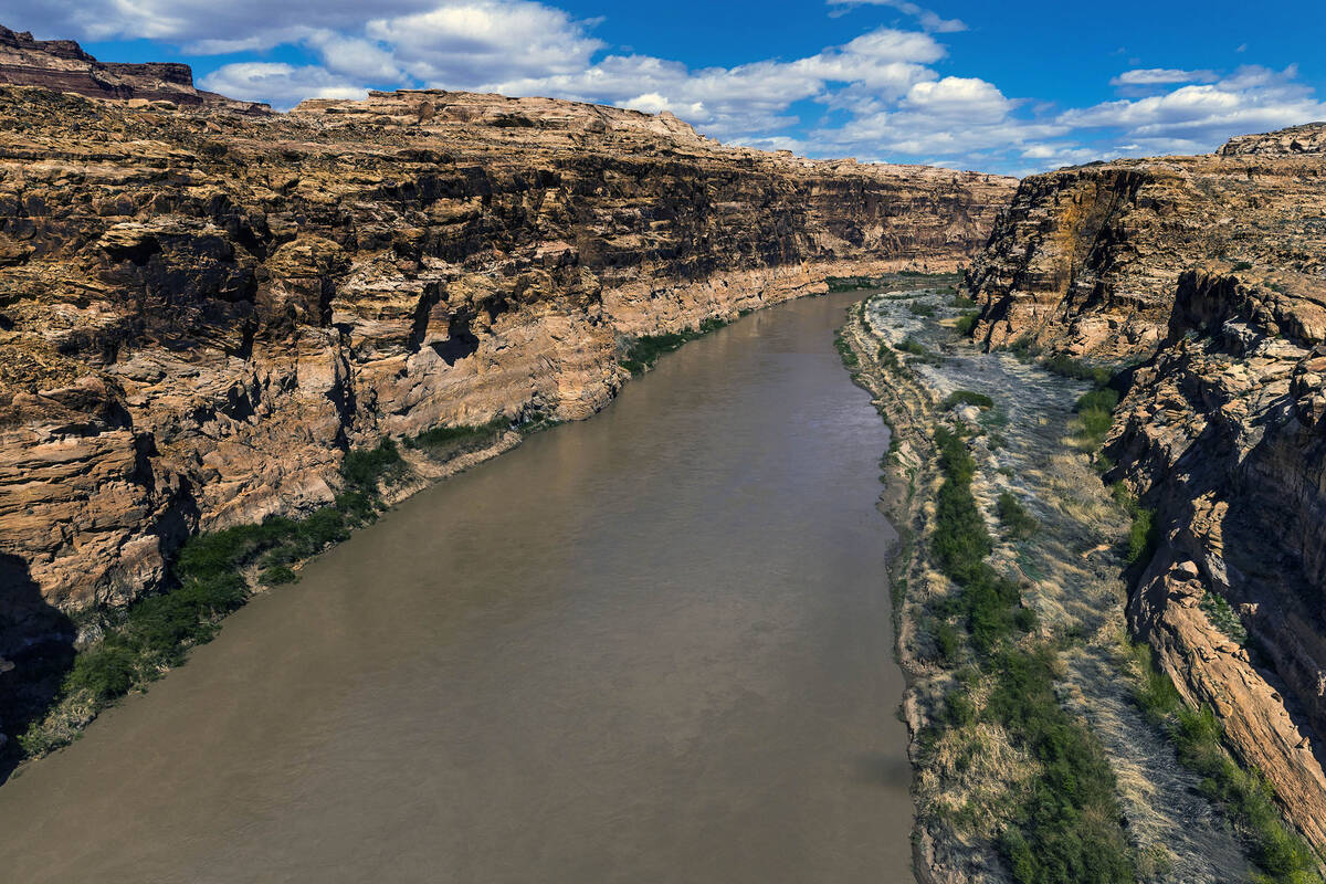 The Colorado River meanders along within the Glen Canyon National Recreation Area about the Hit ...