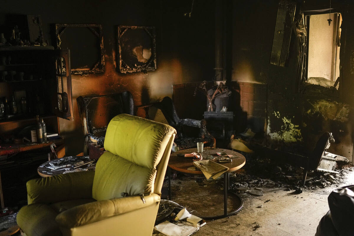 Destroyed furniture and charred walls are seen in a home that came under attack during a massiv ...