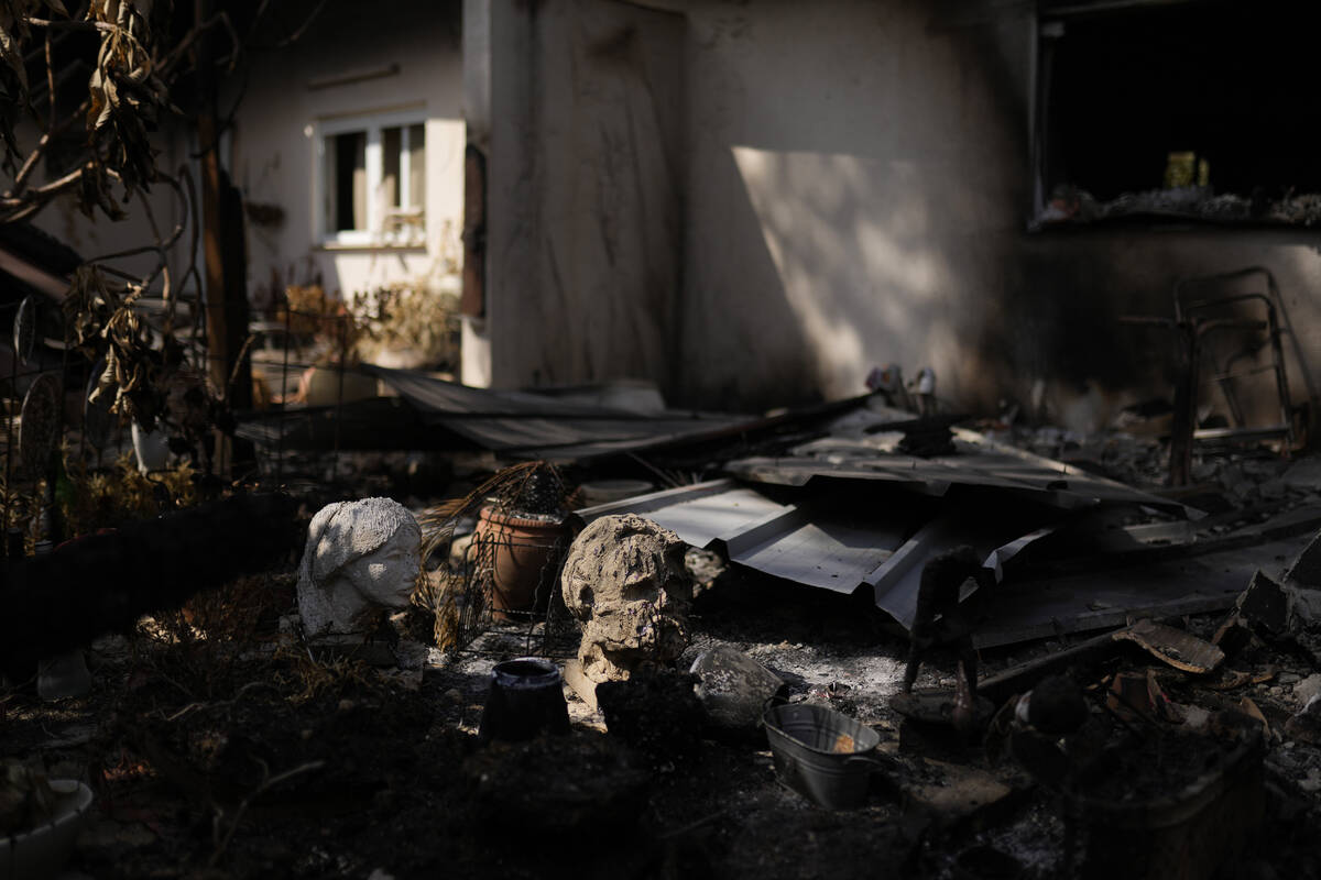 Parts of statues lie among debris in a home that came under attack during a massive Hamas invas ...