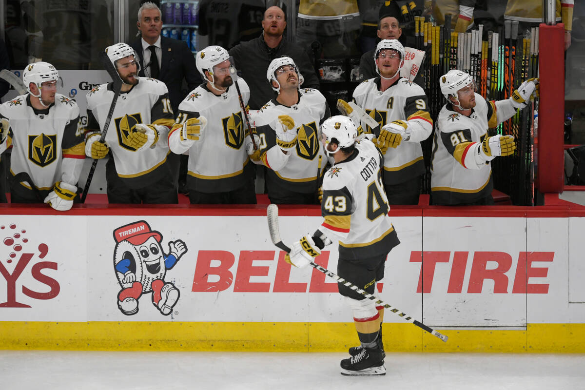 Vegas Golden Knights' Paul Cotter (43) celebrates with teammates at the bench after scoring a g ...