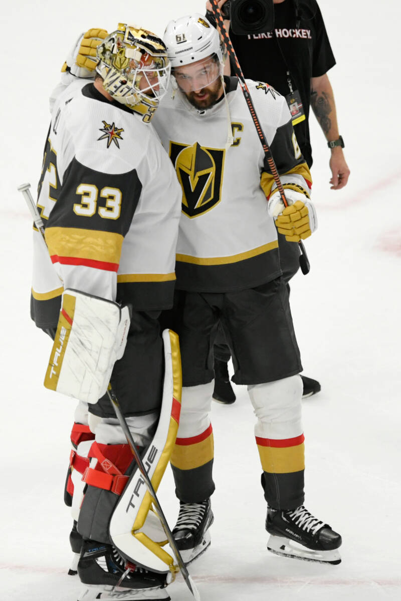 Vegas Golden Knights goalie Adin Hill (33) celebrates with teammate Mark Stone (61) after defea ...