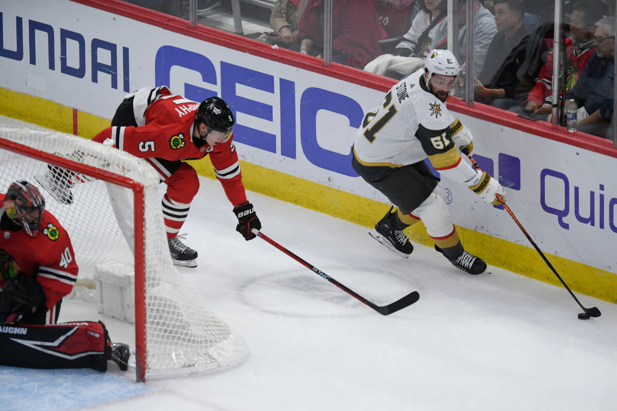Vegas Golden Knights' Mark Stone (61) moves the puck against Chicago Blackhawks' Connor Murphy ...