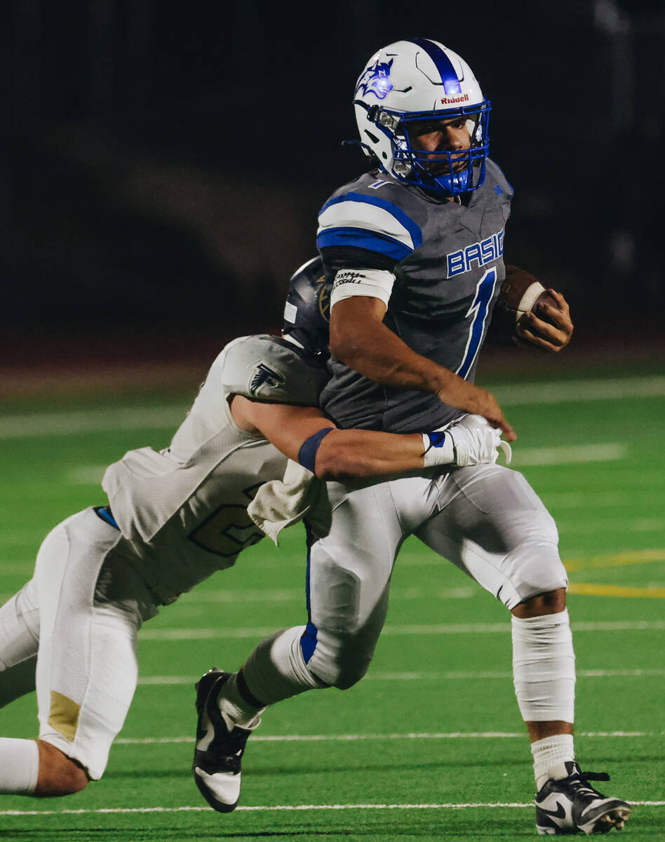 Basic quarterback Anthony Vega (1) runs the ball during a game against Foothill at Basic Academ ...