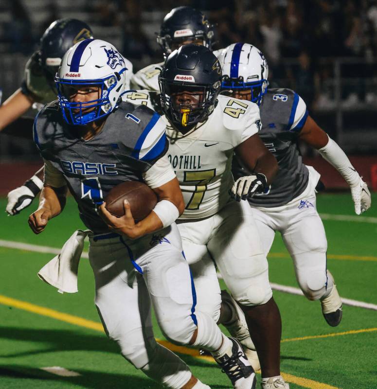 Basic quarterback Anthony Vega (1) runs the ball during a game against Foothill at Basic Academ ...