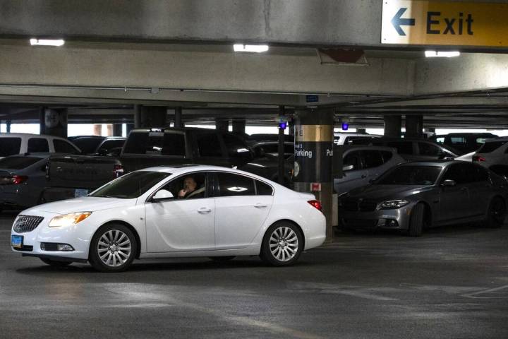 A passenger looks for a parking space at the level 2 of Terminal 1 parking lot at Harry Reid in ...