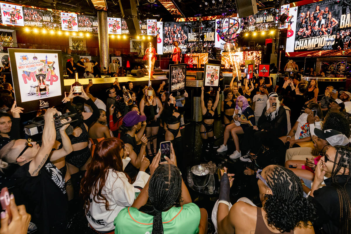 Members of the Las Vegas Aces are shown celebrating their second straight WNBA title at Drai's ...